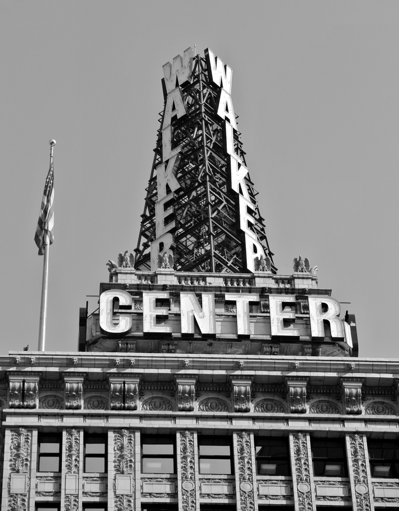 Iron tower atop a building. It reads WALKER going down and CENTER repeats around the base. 